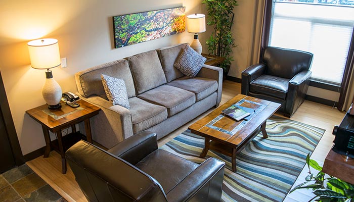 The comfortable living room in the One Bedroom Suite at Silver Creek Lodge.
